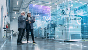 Manufacturing 4.0 Factory Digitalization: Two Industrial Engineers Use Tablet Computer, AI Big Data Analysis. Visualization of High-Tech Facility into 3D Rendered Neural Network. Industry 4.0 Machinery Manufacturing